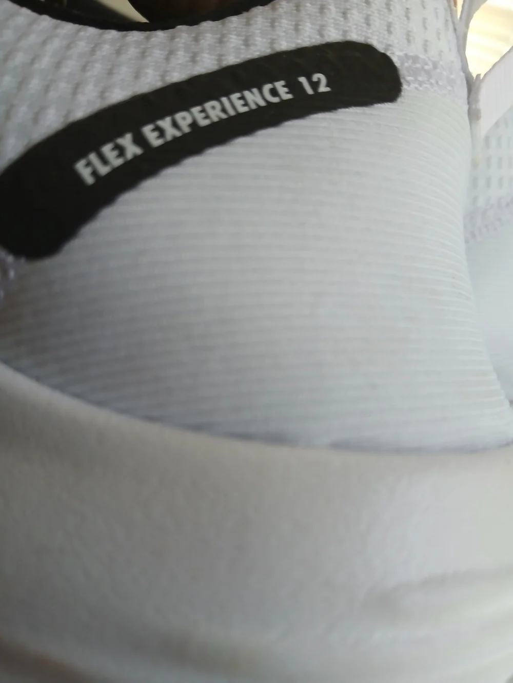 Nike Men’s White Athletic Shoes with Black Swoosh